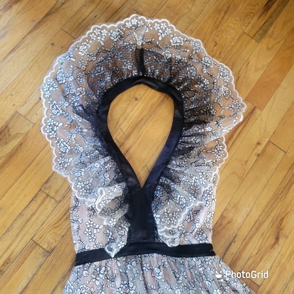 Valentino’s maxi dress is crafted of white, and black scalloped floral lace. - Picture 7 of 7